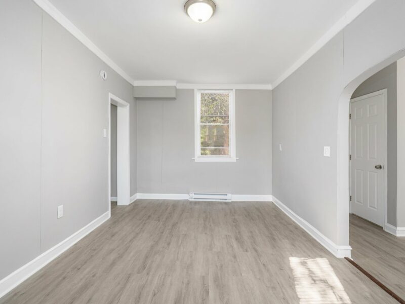 Dining room at 5248 Cordelia Avenue with luxury vinyl plank flooring, neutral walls, and a window.