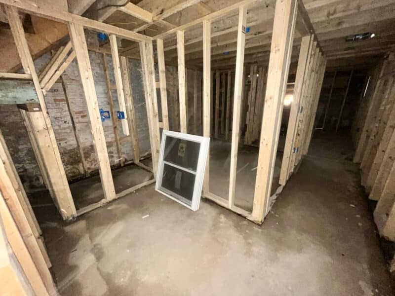Framed room with exposed studs and two windows at 539-549 45th Street, Baltimore County