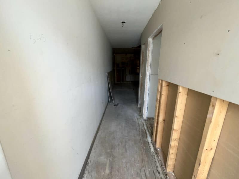 Partially finished hallway with exposed framing and labeled wall at 539-549 45th Street