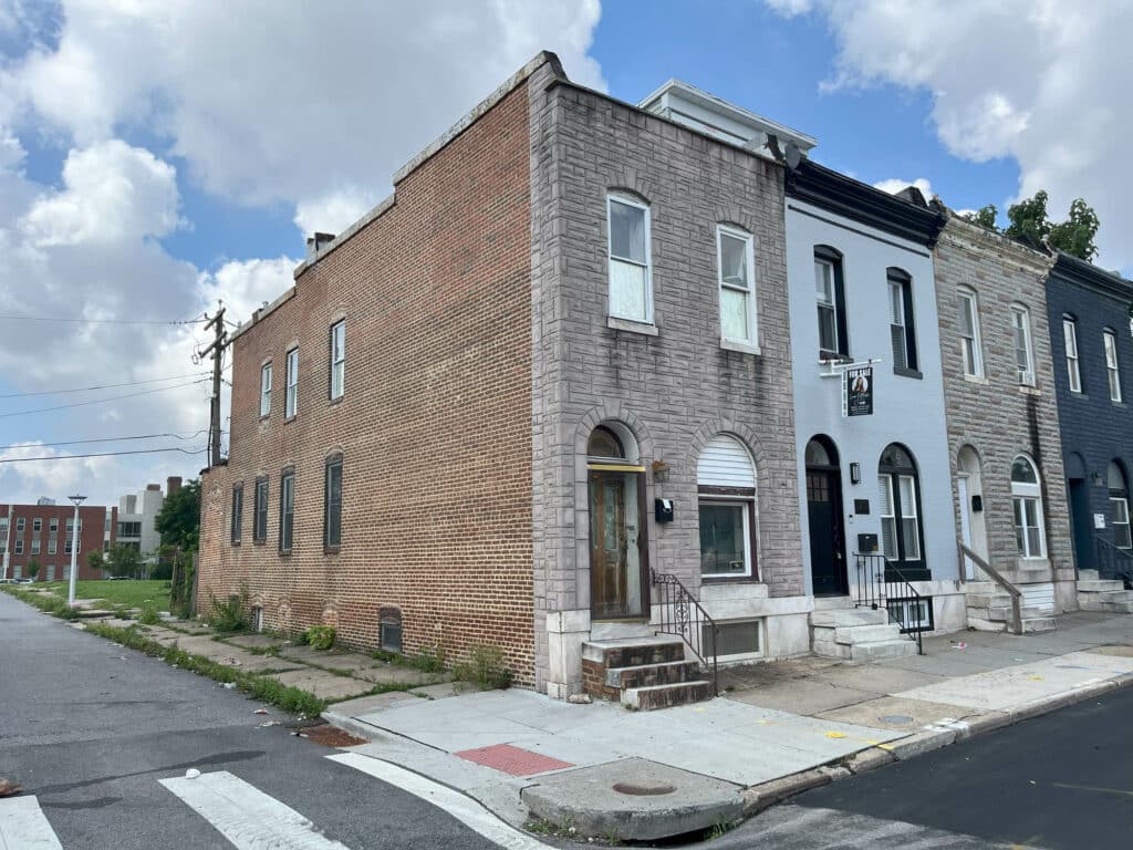 Exterior of 2307 E. Preston Street, brick end-unit townhome on corner lot in East Baltimore’s Broadway East neighborhood.