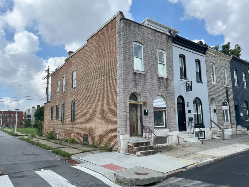 Exterior of 2307 E. Preston Street, brick end-unit townhome on corner lot in East Baltimore’s Broadway East neighborhood.