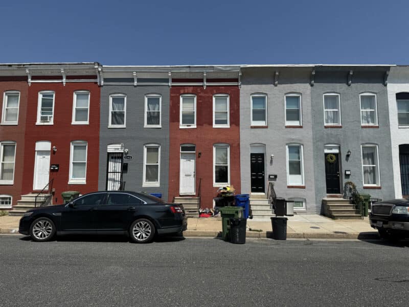 Front exterior of a two-story brick townhome at 1346 Carroll Street in Washington Village/Pigtown, Baltimore, offered at online auction.