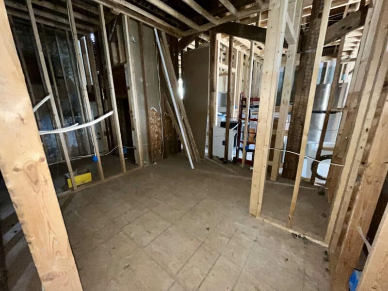Interior view of gutted and newly framed apartment unit with visible plumbing and open layout at 539-549 45th Street in Baltimore County.