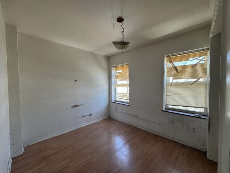 First bedroom at 1346 Carroll Street with vinyl plank flooring and natural light.