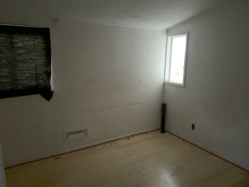Bedroom at 4761 Bonnie Brae Road with laminate flooring and a window for natural light.