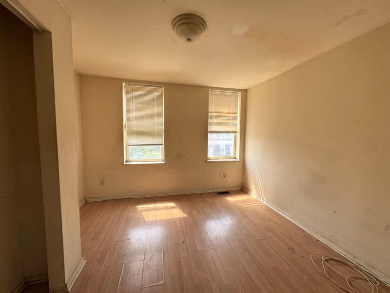 Second bedroom at 1346 Carroll Street with vinyl plank flooring and window view.