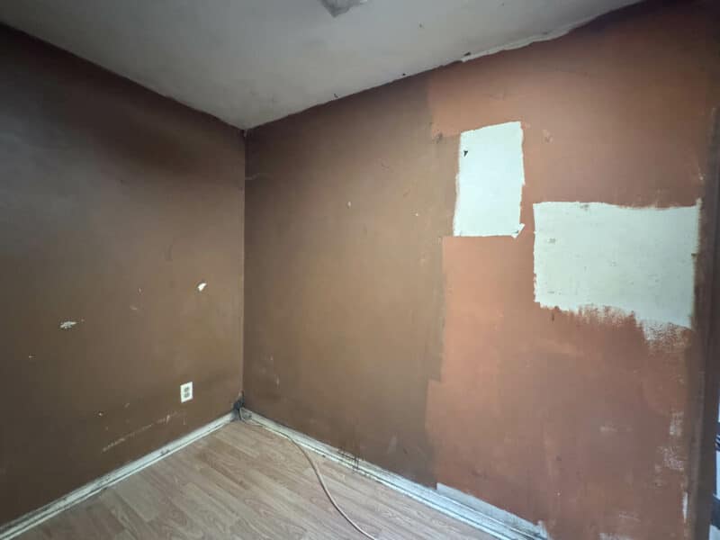 Third bedroom at 1346 Carroll Street with vinyl plank flooring and partially painted walls.