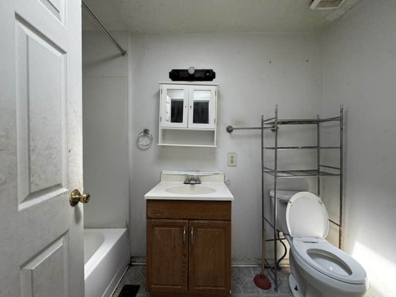 Bathroom at 1346 Carroll Street with laminate flooring and standard fixtures.
