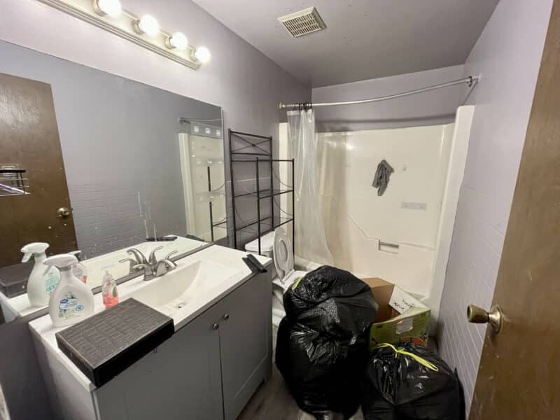 Second floor full bathroom with single-sink vanity, combination tub and shower, and overhead lighting at 12366 Bonfire Drive.