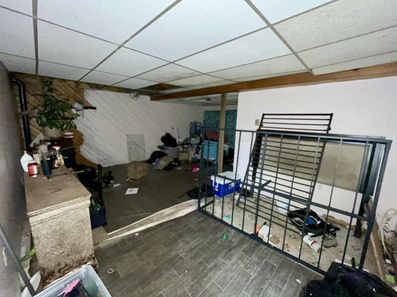Finished basement family room with laminate flooring and drop ceiling at 12366 Bonfire Drive in Reisterstown, Maryland.