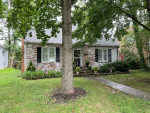 Front exterior view of brick and siding bungalow at 19 Dunmore Road with landscaped yard and flagstone walkway.