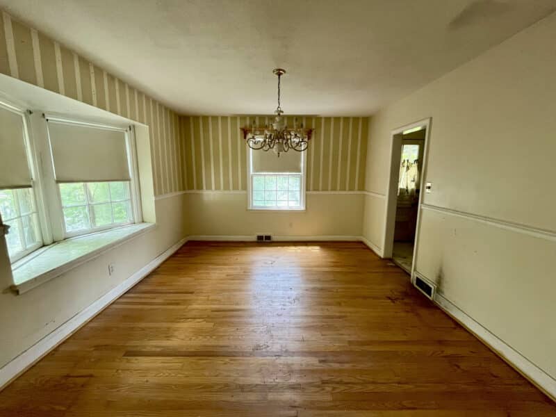 Dining room with hardwood floors, bay window, and chandelier at 1729 Edgewood Road.
