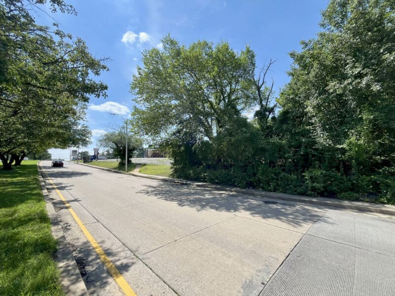 View of Sinclair Lane with mature trees and wide sidewalk near the subject property in the Frankford neighborhood of Baltimore City.