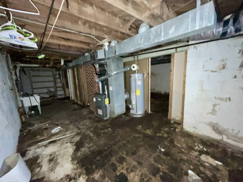 Basement utility area featuring HVAC system and water heater at 4902 Gilray Drive.
