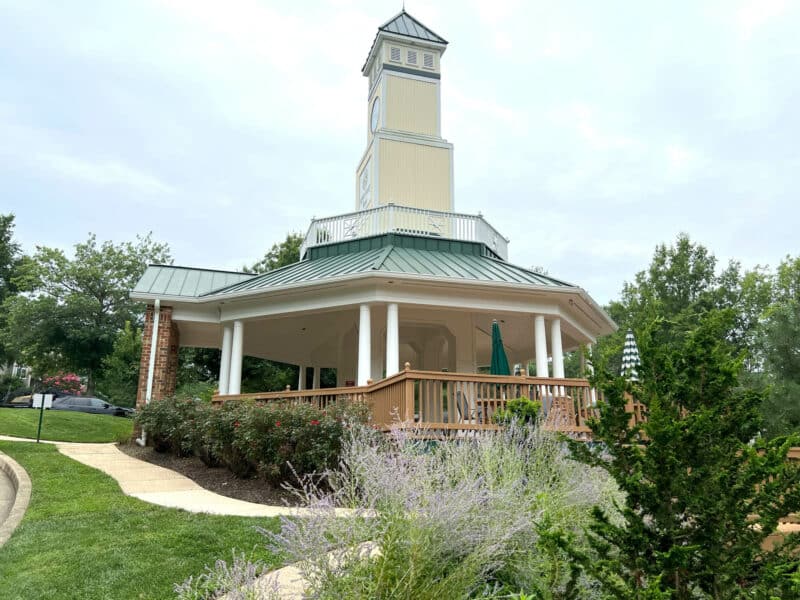 Charming community gazebo with cupola, surrounded by landscaped gardens and walking paths.