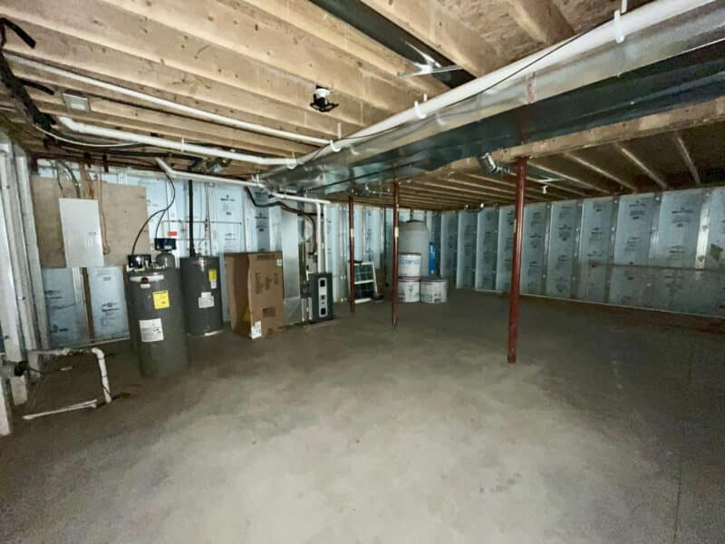 Mechanical area with water heaters and utility systems.