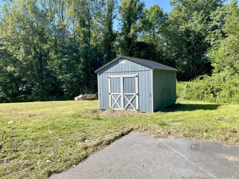 Freestanding storage shed on rear of property.