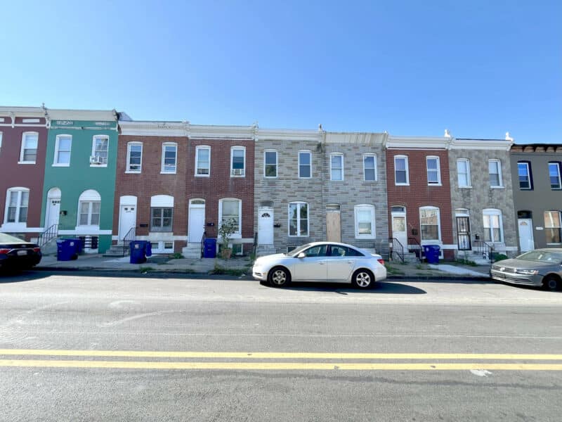Row of two-story Baltimore townhomes on E. Federal Street in the Broadway East neighborhood.