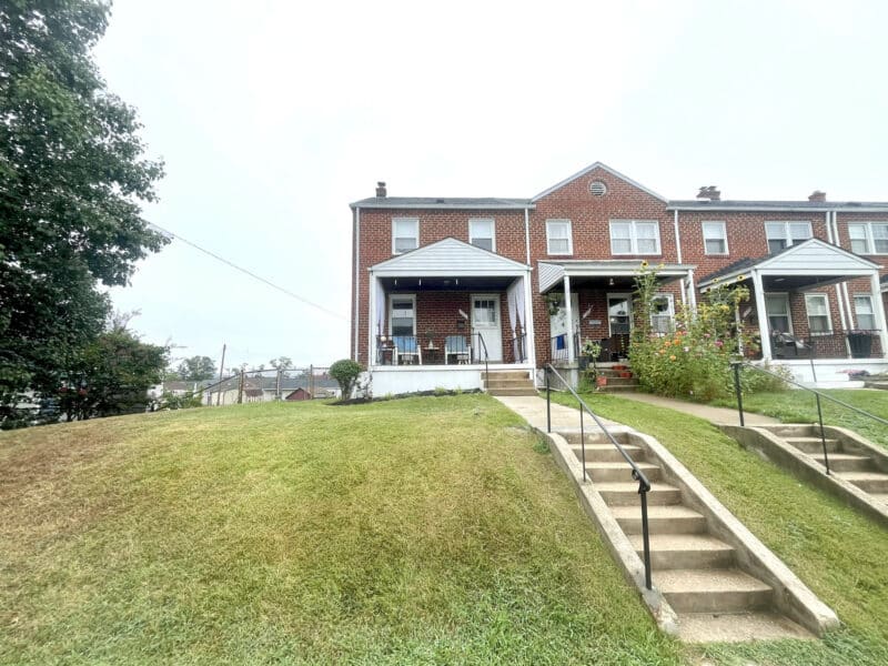 Stairway and walkway leading to brick porchfront townhome in Arbutus.