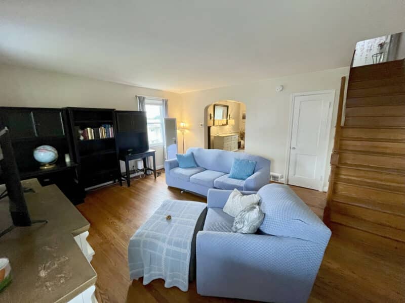 Living room at 1000 Downton Road in Arbutus featuring hardwood floors, neutral walls, and natural light.