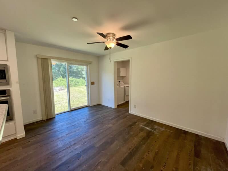 Dining space with sliding glass doors leading to backyard.