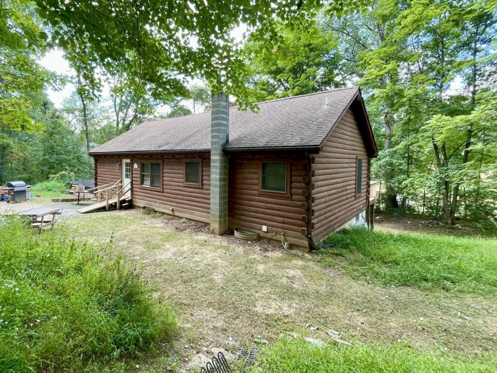Log cabin style home with wood siding and pitched roof in Freeland, Baltimore County.