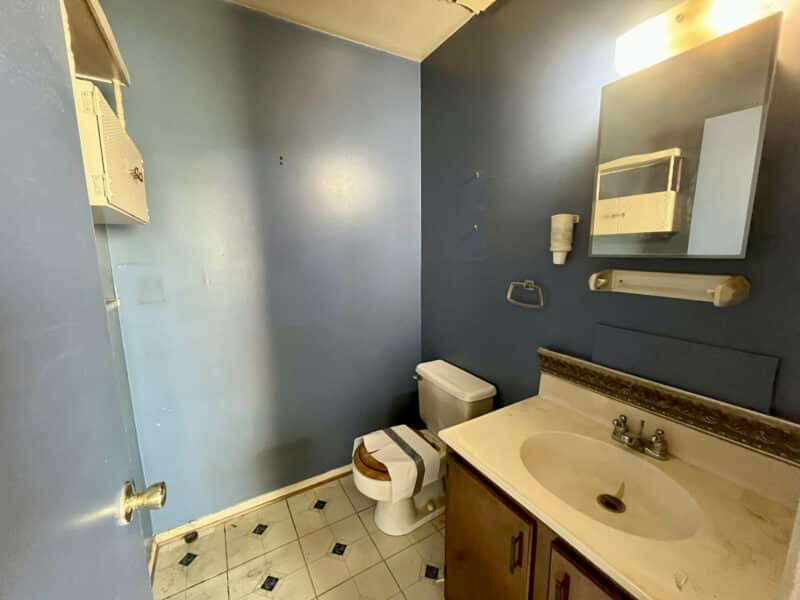 Primary bathroom in suite with single-sink vanity, toilet, and tiled floor at 334 Royer Road, Westminster, MD.