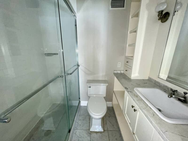 Full bathroom with glass shower enclosure