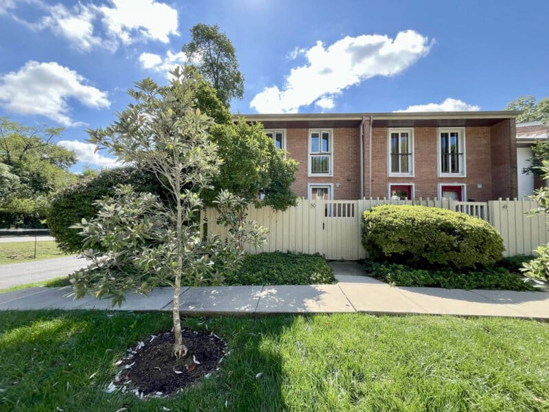 Front exterior with landscaping and sidewalk