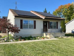Front exterior view of 334 Royer Road, a single-story rancher with solar panels and a well-kept front lawn in Westminster, Maryland.