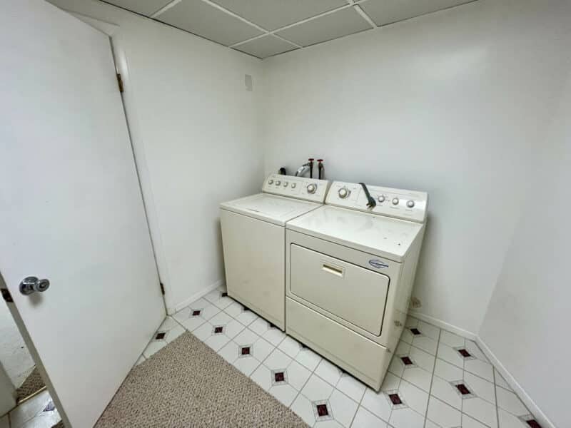 Basement laundry room with washer and dryer at 7245 Meadow Lane.