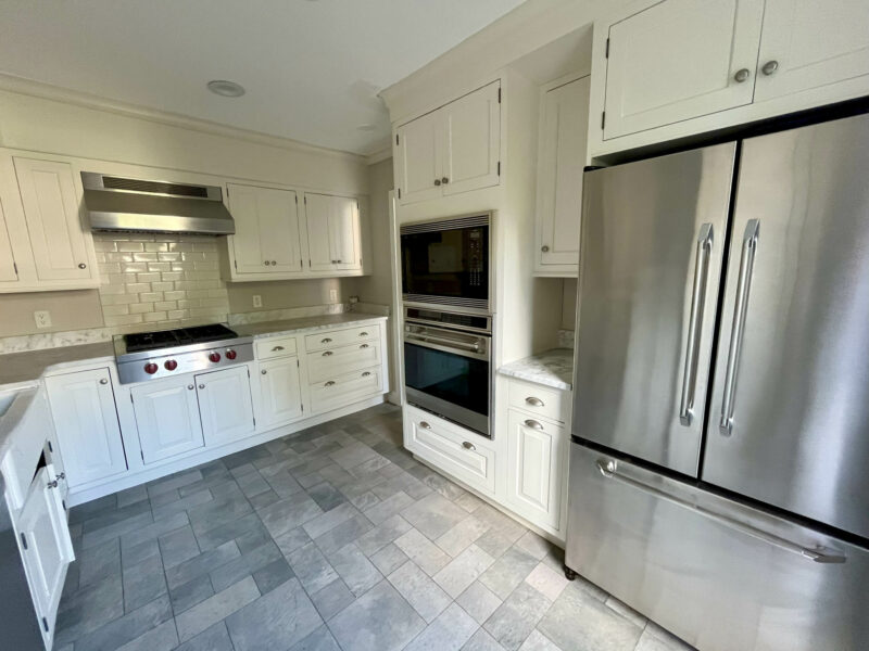 Kitchen with stainless steel appliances and white cabinets