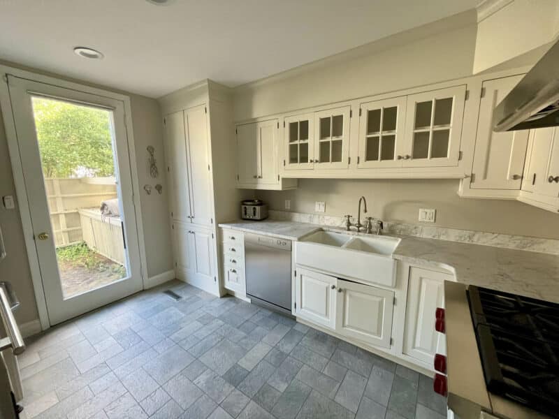 Kitchen with farmhouse sink and patio access