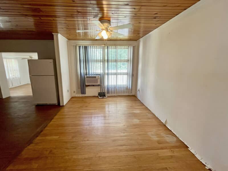 Family room or breakfast area with sliding glass doors and ceiling fan.