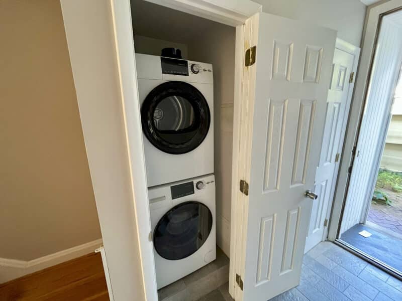 Laundry closet with stacked washer and dryer