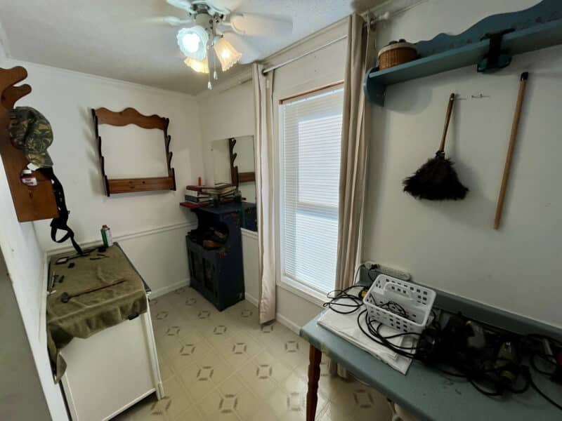 Flex room or craft space at 1207 Joppa Road in Joppa, MD, featuring bright windows, shelving, and multipurpose workspace.