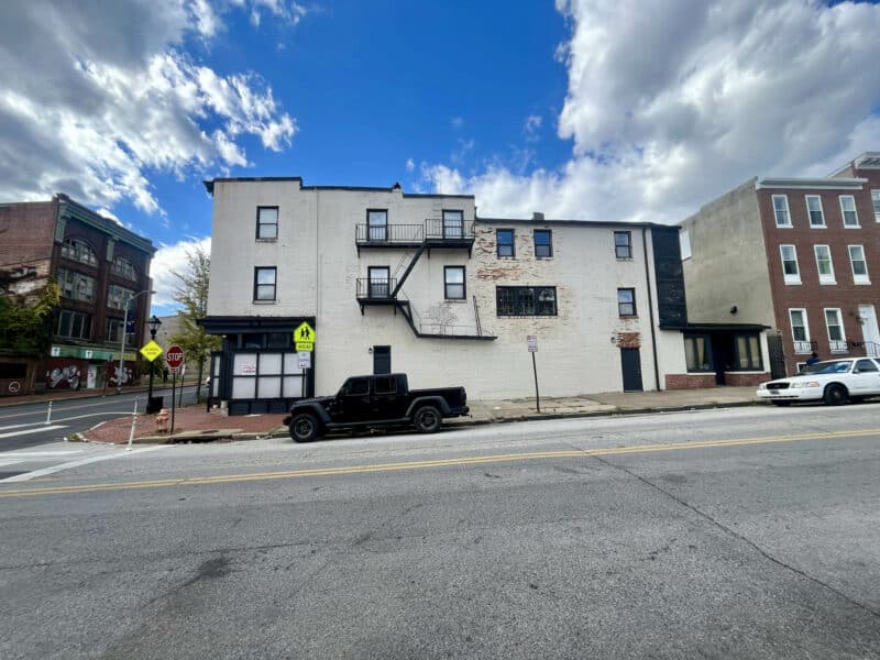 Side façade of 1500 W. Baltimore Street showing fire escape and secondary entrances.