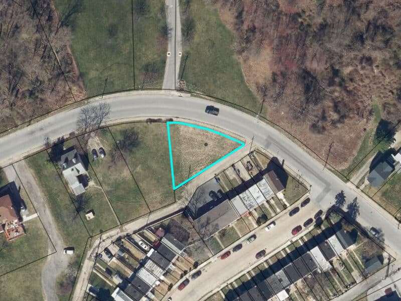 Aerial GIS image outlining the triangular 0.323±-acre parcel at 4611 Bowleys Lane in blue, surrounded by homes and roadways.