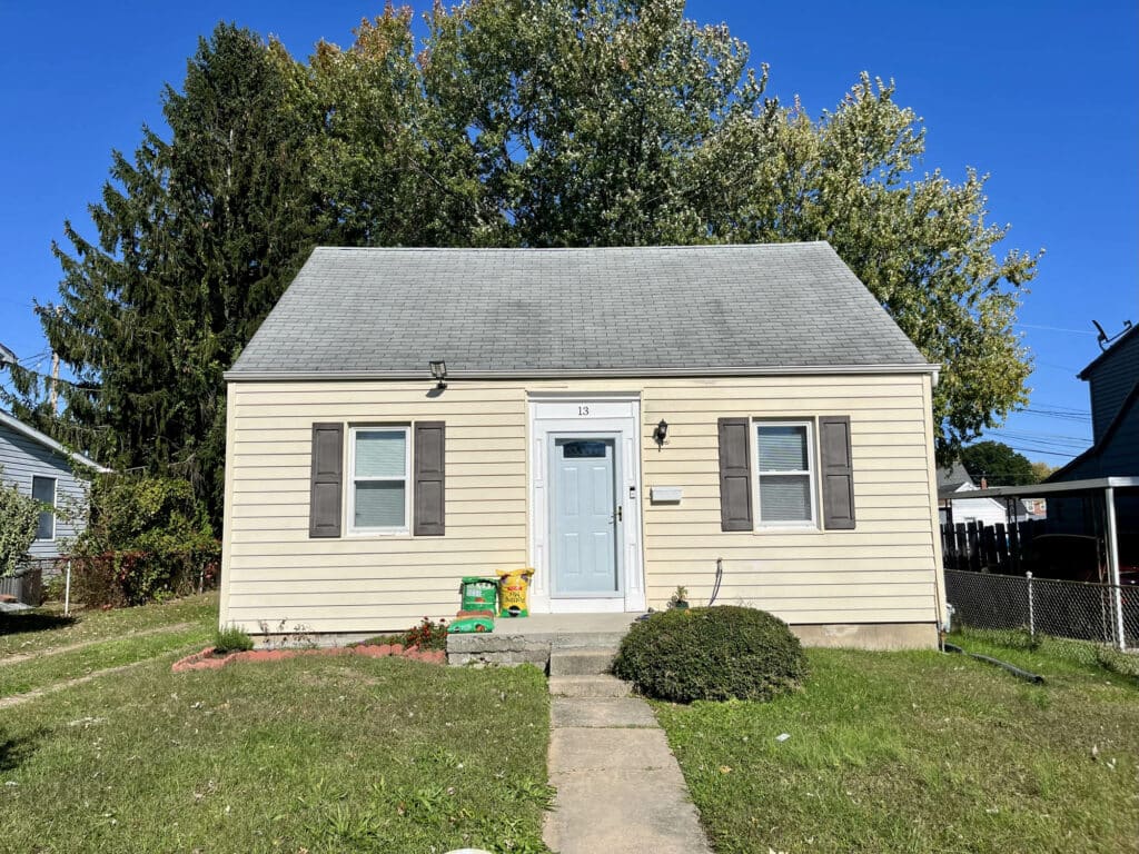 Front exterior view of one-and-one-half-story bungalow in Essex, Maryland.