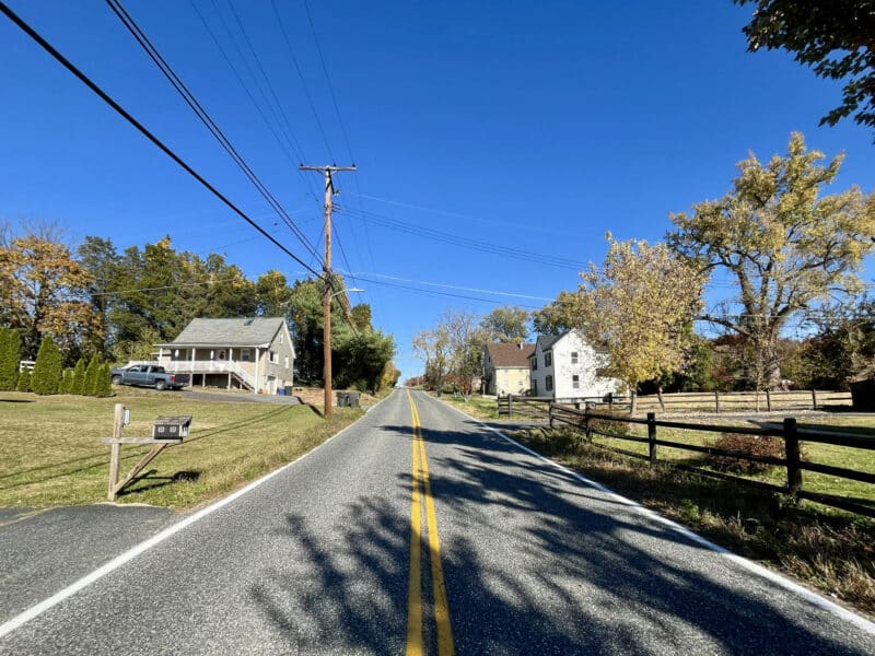 Street view of Joppa Road near 1207 Joppa Road in Joppa, Maryland, showing residential setting, mature trees, and paved roadway.
