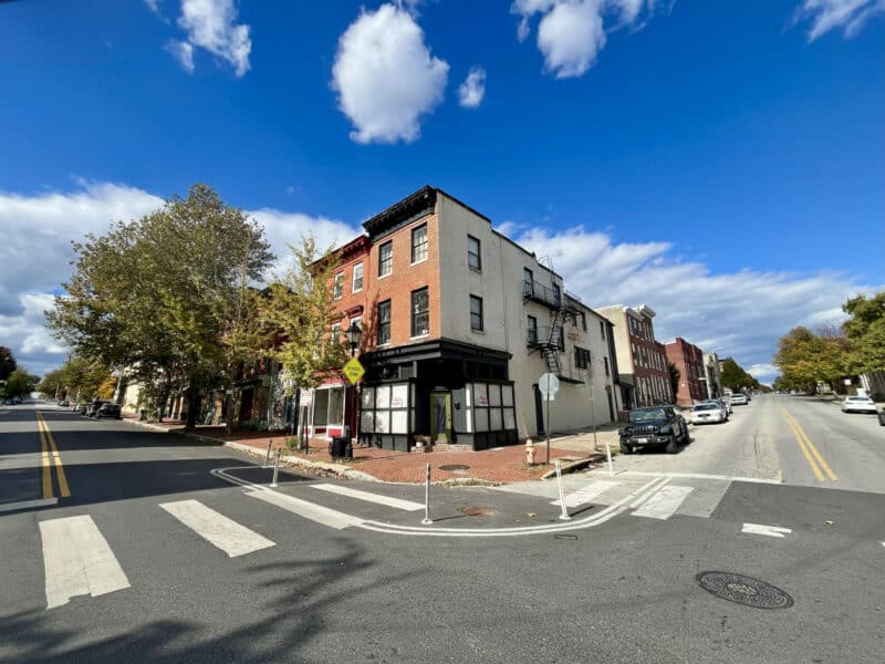 Streetscape view showing 1500 W. Baltimore Street and surrounding mixed-use buildings along W. Baltimore Street.
