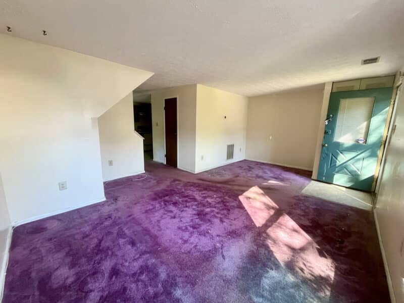 Spacious living room with large window and natural light in Silver Spring townhome.