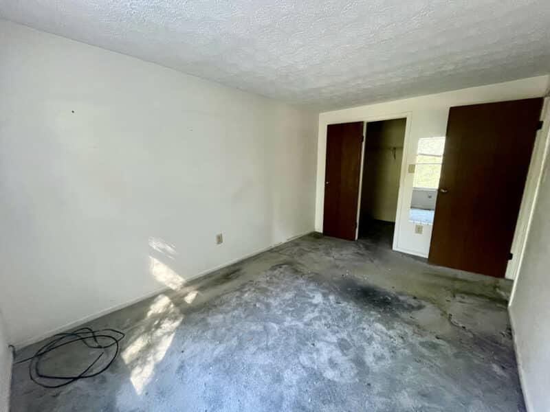 Third bedroom with closet doors and hallway access.