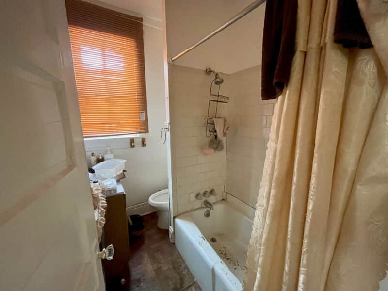 Full bathroom with tub and vanity at 2701 Baker Street.
