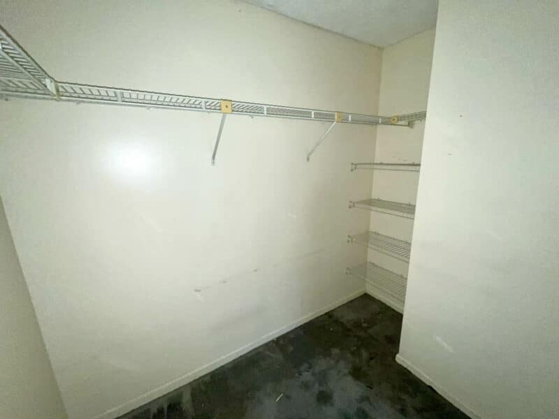 Walk-in closet with wire shelving and storage space.