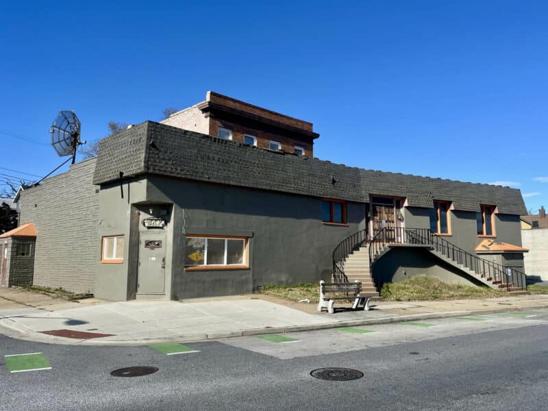 Front exterior of 6826–28 Harford Road commercial building in the Parkville area, Baltimore City, showing entrance, staircase, and street visibility.