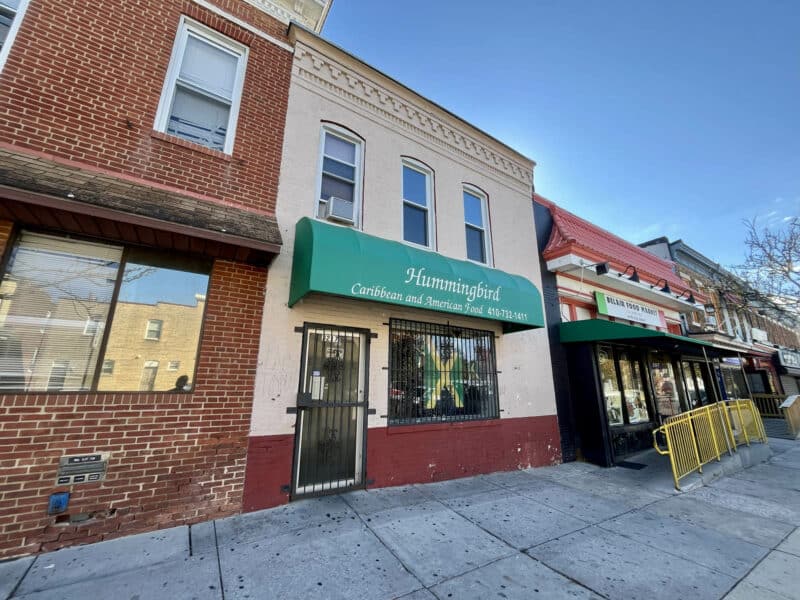Street-level view showing 3217 Belair Road beside neighboring retail buildings on Belair Road in Northeast Baltimore.
