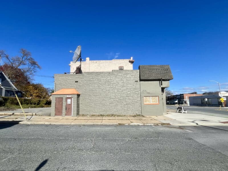Side elevation of the commercial building at 6826–28 Harford Road showing sidewalk frontage and secondary entry façade.