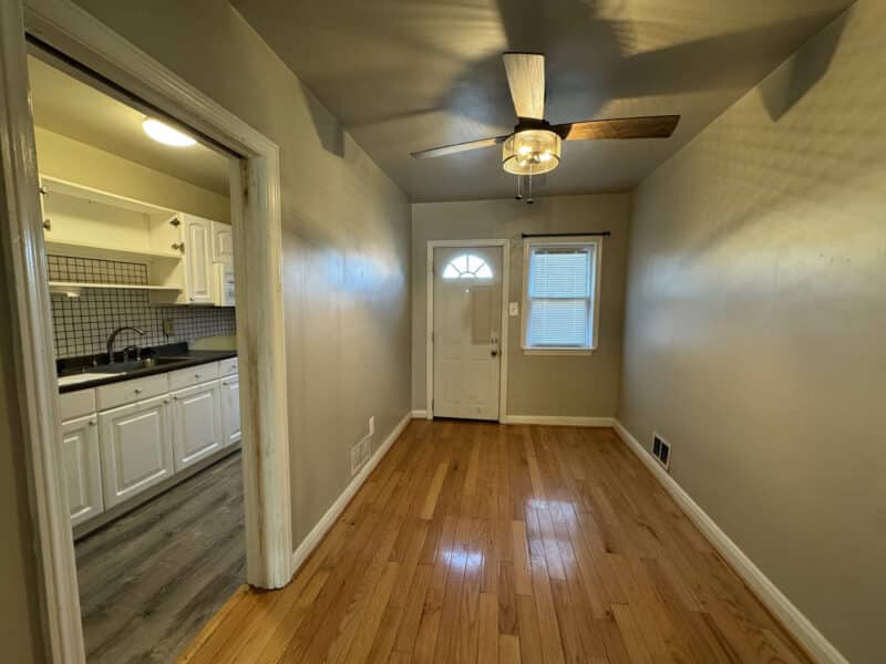 Dining room at 2808 Windsor Avenue with hardwood floors and ceiling fan.