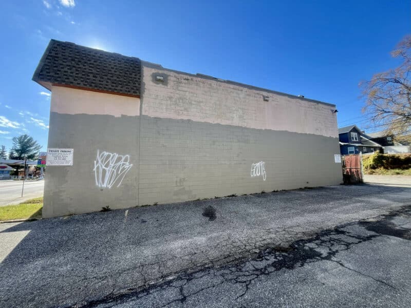 Rear wall of 6826–28 Harford Road commercial building showing service area and secondary façade.